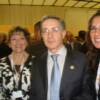Frieda de Garcia y Frieda Garcia con el Presidente de Colombia Alvaro Uribe en la XVIII Cumbre Iberoamericana